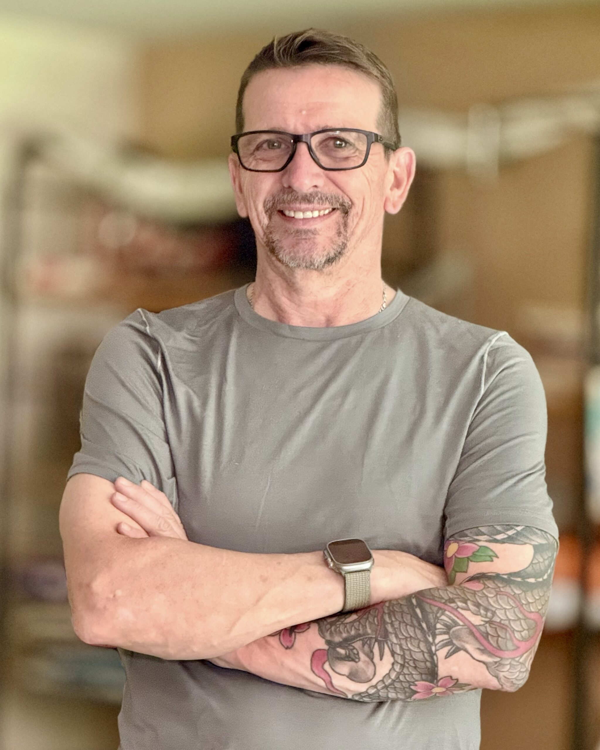 Smiling Middle-Aged Man with Glasses and a Short Beard